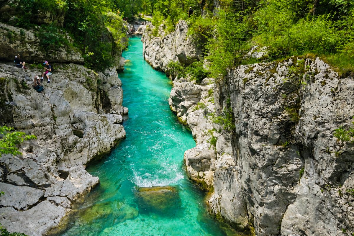 Turquoise Soča River flowing through a narrow rocky gorge in the Julian Alps
