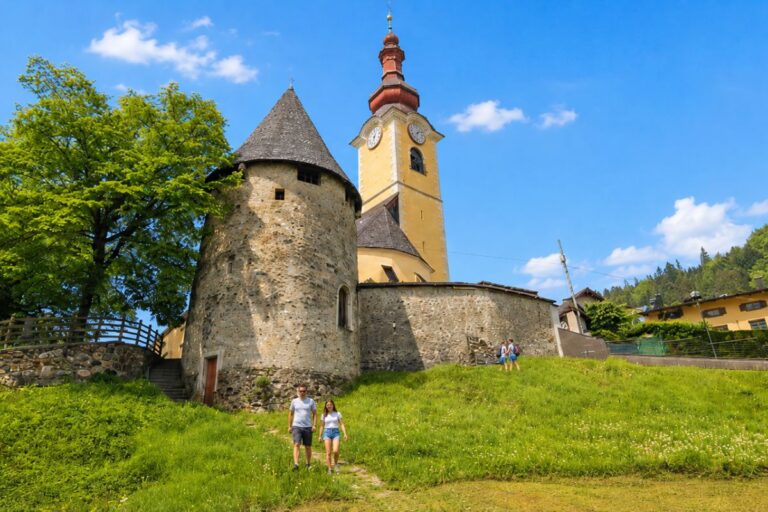 Tarvisio Church and Medieval Tower Tarvisio church and medieval tower on a sunny day