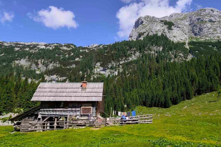 A solitary shepherd hut on the Laz pasture with mountains in the background.