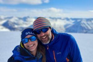 two people in the mountains in winter