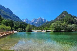 Calm Lake Jasna reflecting the mountains and blue sky.