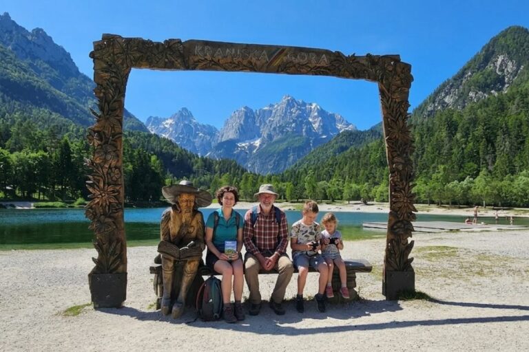Around Kranjska Gora Visitors at Lake Jasna in Kranjska Gora with the Julian Alps in the background